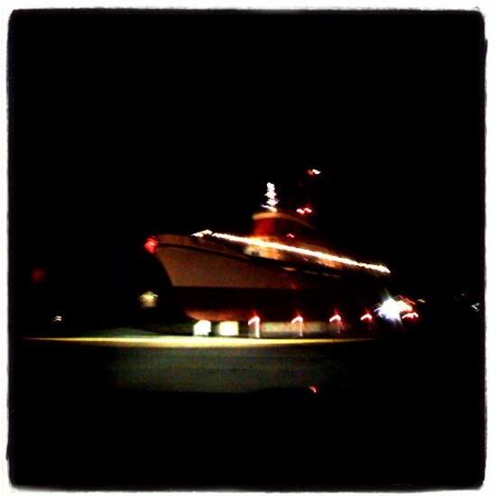 A boat decked out in Christmas lights