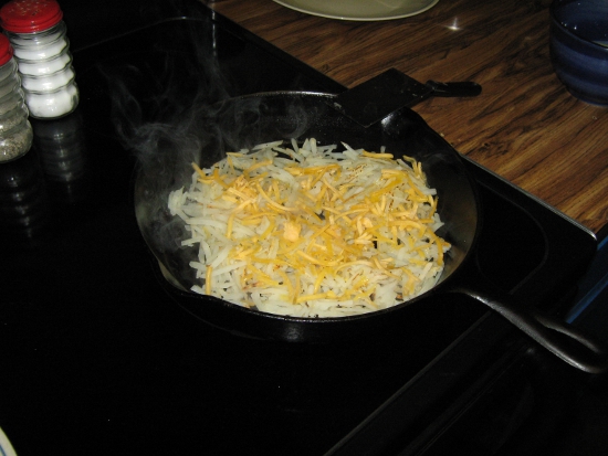 Adding cheese to the hash browns