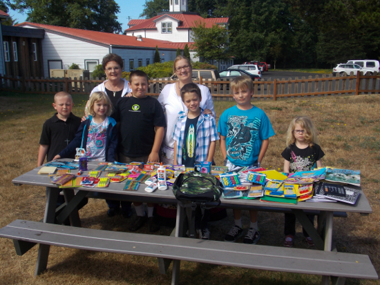 Staff of the church and Sunday school students with the #BagItForward donation