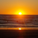 Surfers in the sunset