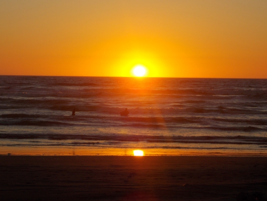 Surfers in the sunset