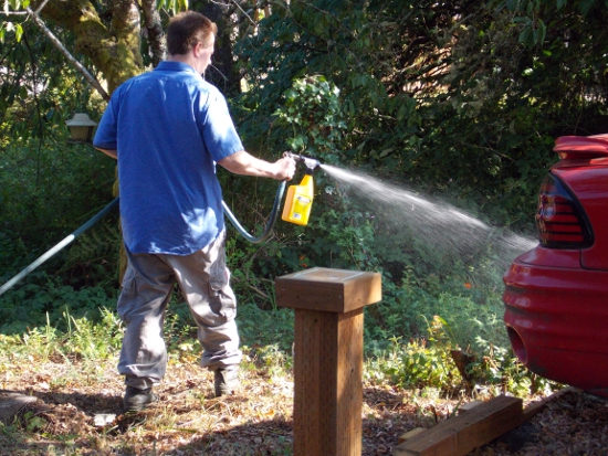 Using mole repellent spray