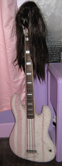 Guitar-turned-wig-holder