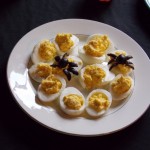Olive spiders on deviled eggs