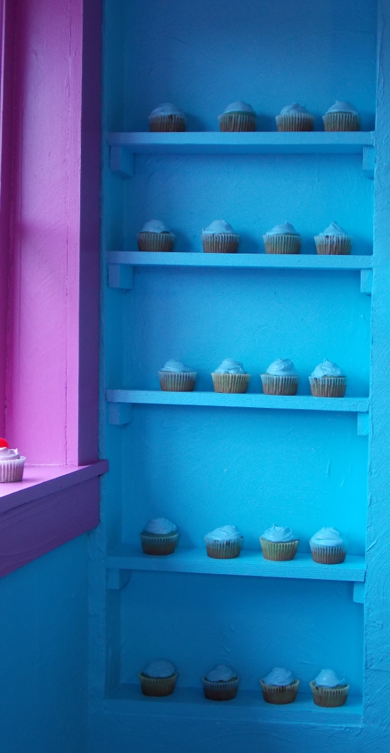 Cupcakes displayed on the shelving