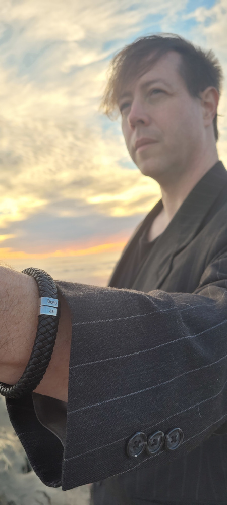 Closeup of Men’s Leather Bracelet With Oval Name Beads